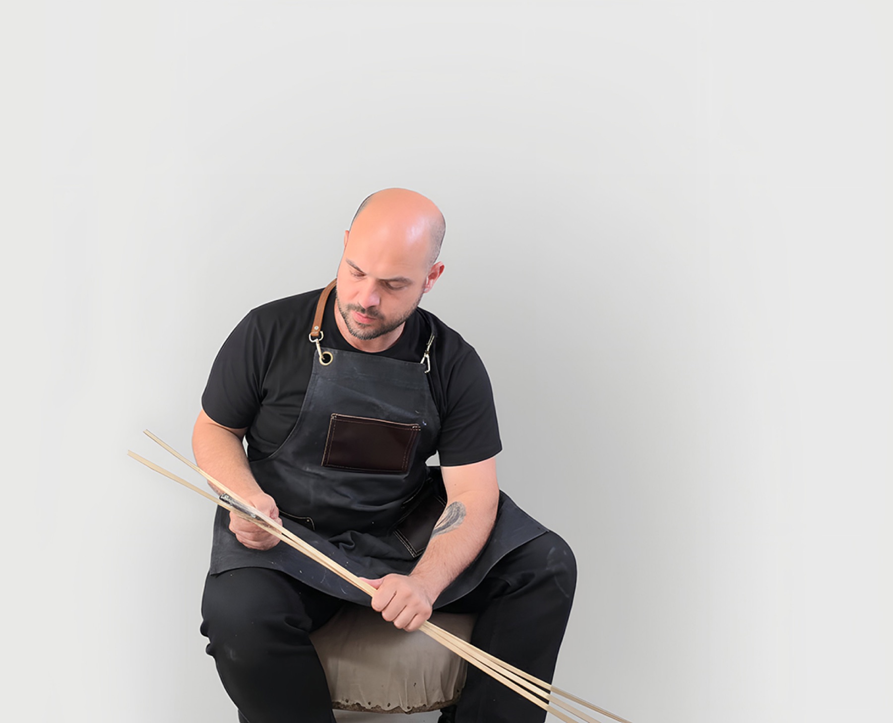 Ghyslain Kuehn holding bamboo strips